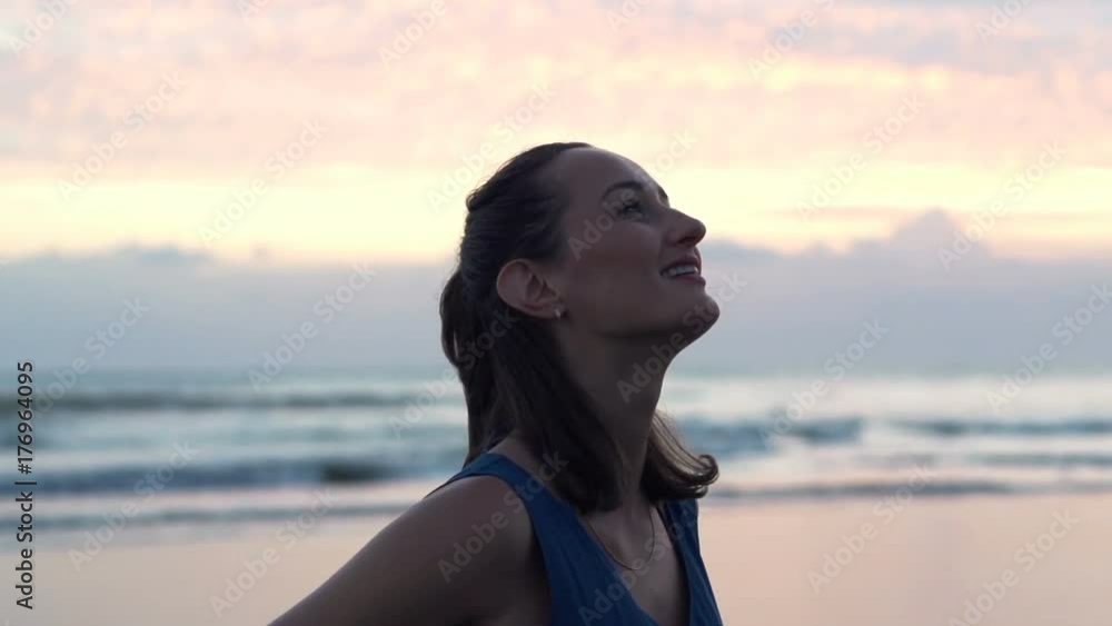 Happy, pretty woman admire sunset on beach, super slow motion 240fps
