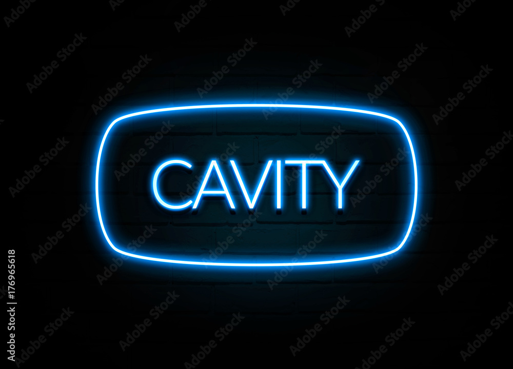 Cavity - colorful Neon Sign on brickwall Cavity - colorful Neon Sign on brickwall