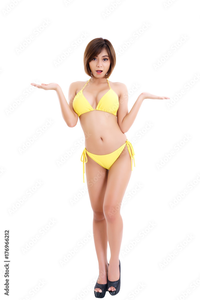 Beautiful young brunette Asian woman wearing yellow bikini open both hands  , concept for placing a sign or object , isolated on white background  Photos | Adobe Stock