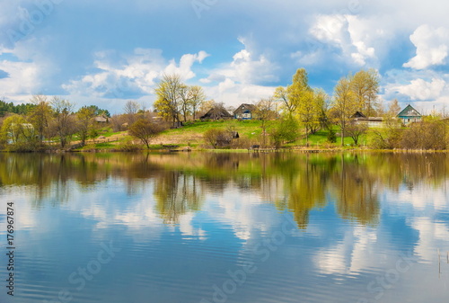 Fototapeta Naklejka Na Ścianę i Meble -  small village on shore of lake in spring