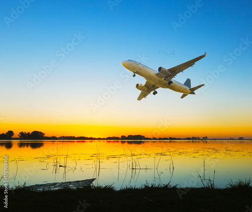 Plane flying above water