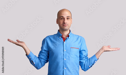Photos bald man making dont know gesture