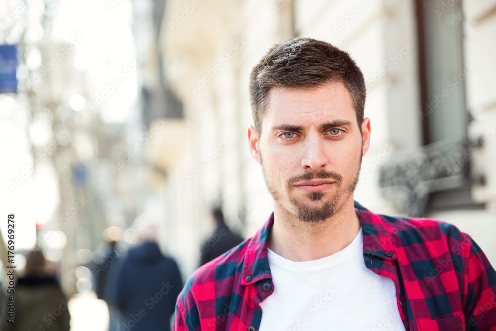 Naklejka premium portrait of young attractive man outdoors