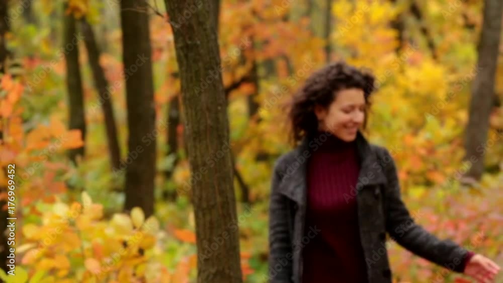 girl walking through autumn forest girl walking through autumn forest