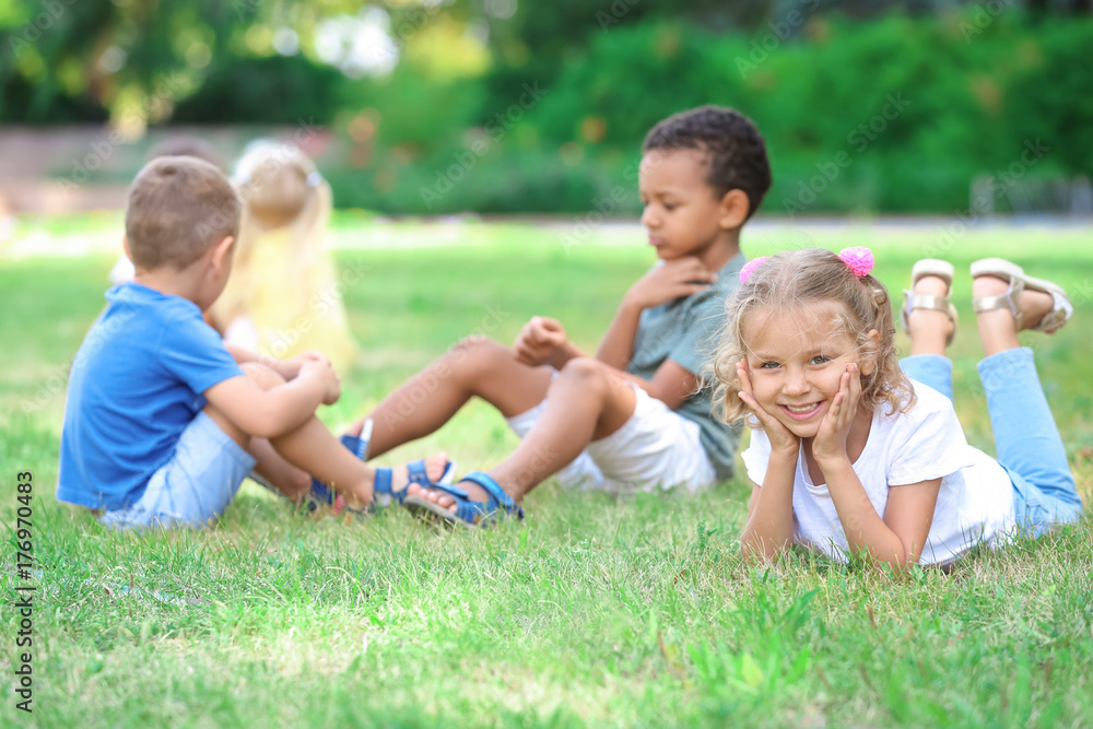 Cute little children playing on green grass Cute little children playing on green grass
