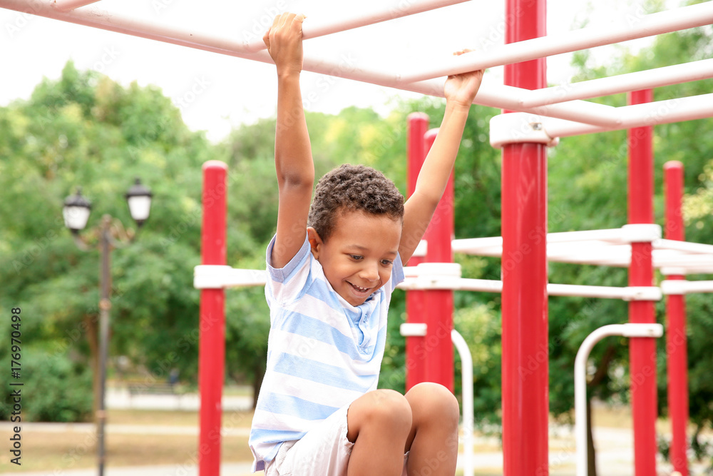 Cute African American boy on playground Cute African American boy on playground