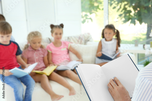 Woman reading books with cu...