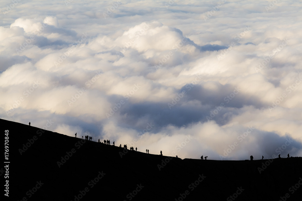 Tourists walking on the steep trail to Sulfur Mines on Ijen volcano, East Java. Tourists walking on the steep trail to Sulfur Mines on Ijen volcano, East Java.