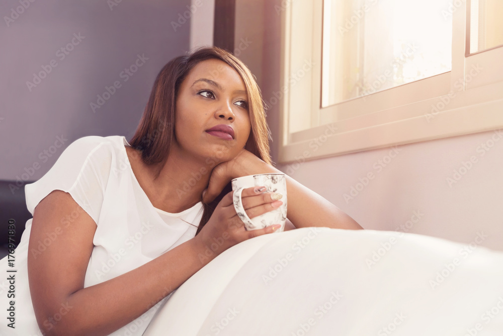 Young Lady Sitting And Relaxing By The Window Young Lady Sitting And Relaxing By The Window
