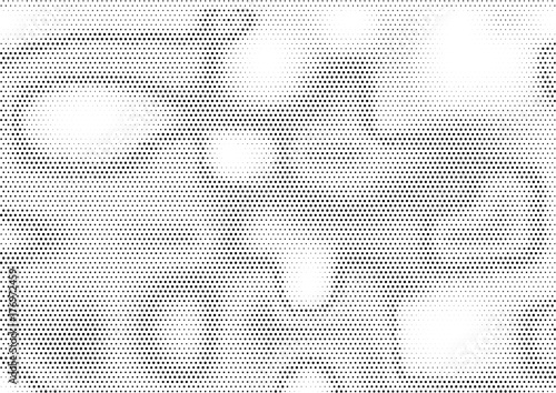 Creative horizontal halftone background with unevenly distributed dots in black and white colors
