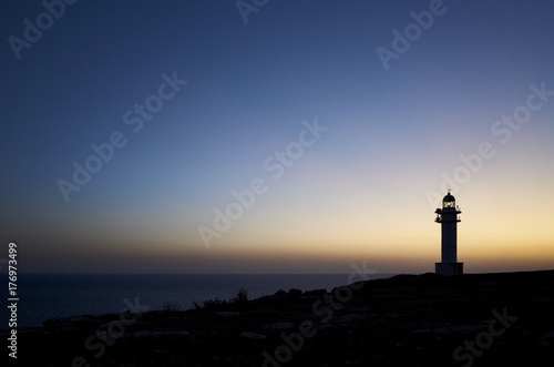 Barbaria Cape Lighthouse in spanish Formentera Island at the sunset