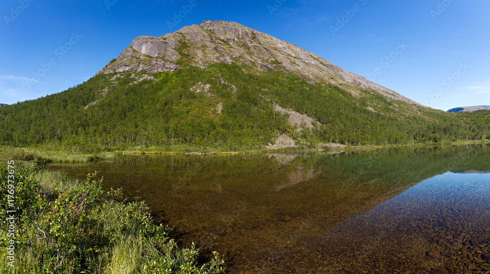 Mountain lake with clear water. Kola Peninsula , Khibiny . Russia.