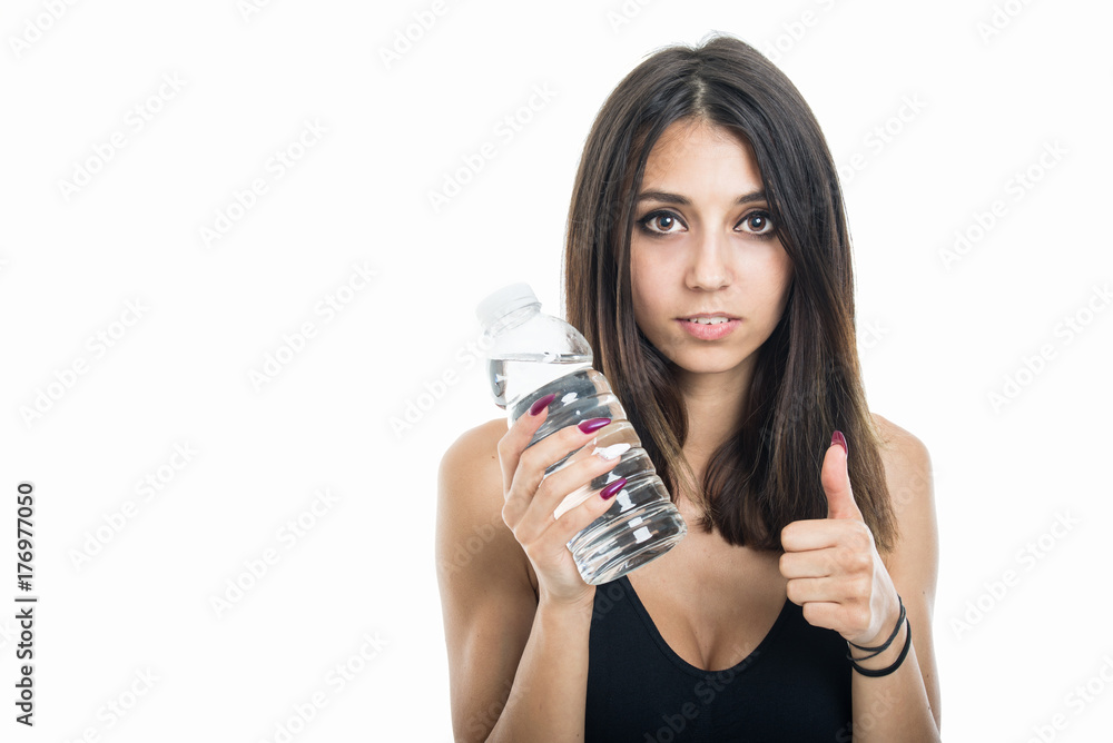 Portrait of fit girl holding water shoeing like Portrait of fit girl holding water shoeing like