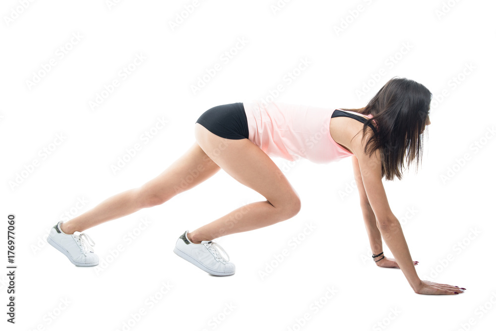 Full body of fit girl exercising wearing shorts Full body of fit girl exercising wearing shorts