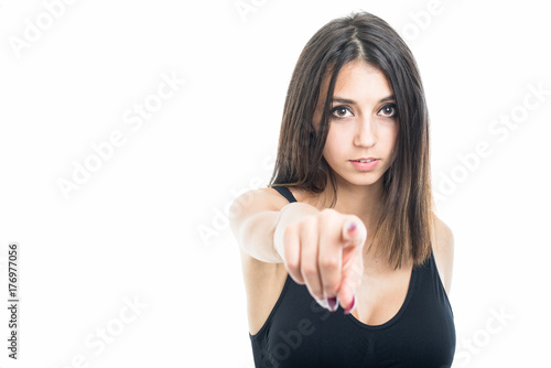 Portrait of fit girl pointing camera