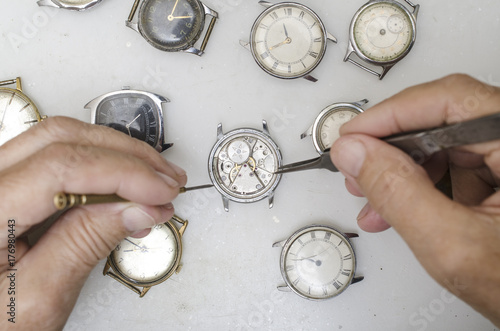 Repair of mechanical watches isolated on white