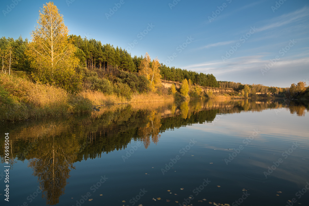 Autumn landscape on the river in the evening. Autumn landscape on the river in the evening.