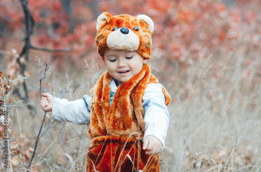 child bear costume in the forest, very cute and funny child bear costume in the forest, very cute and funny