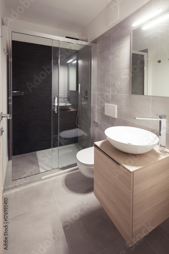 Modern apartment  toilet. Interior of a modern small new bathroom. The washbasin is white circular.