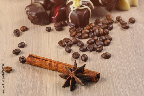 cinnamon with homemade sweets on a wooden background