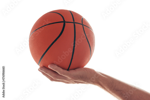 Male hand with basketball ball isolated on white background © Bits and Splits