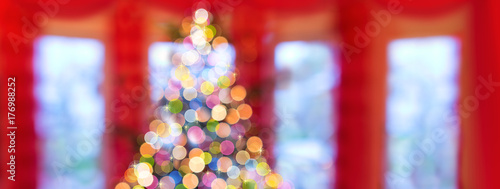 Christmas background with colorful bokeh fir tree.