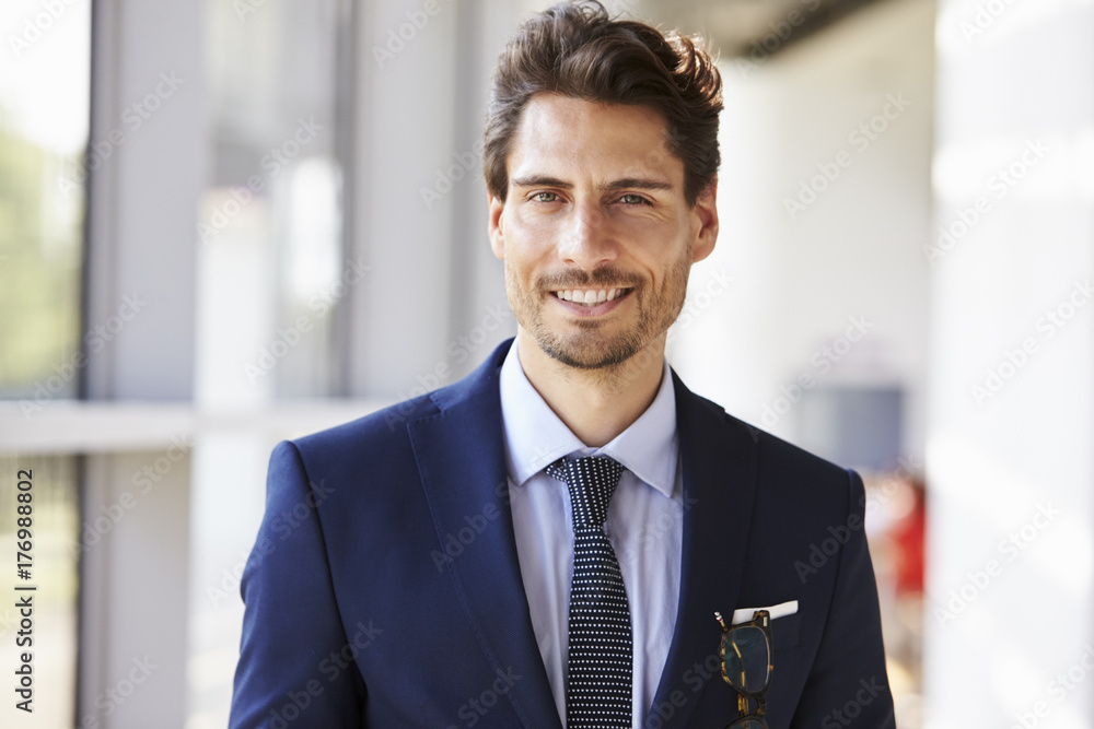 Portrait of smiling professional young man in suit Portrait of smiling professional young man in suit