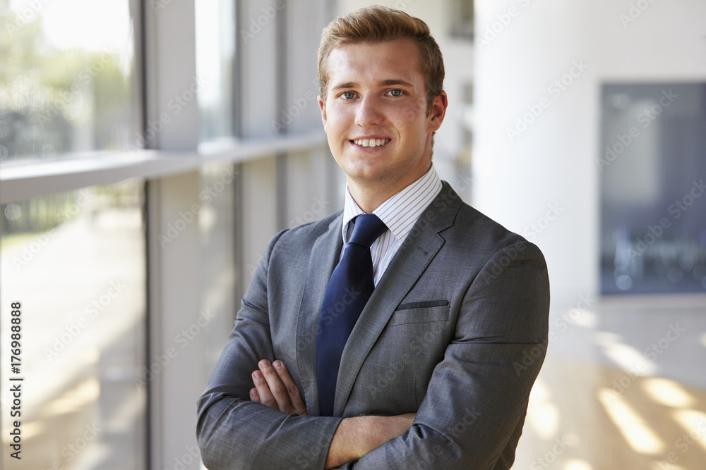 Portrait of a young smiling professional man, arms crossed Portrait of a young smiling professional man, arms crossed