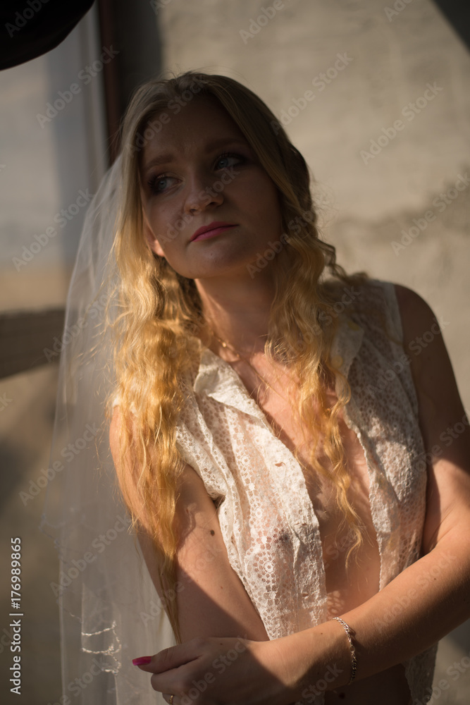 young bride girl in lingerie and lace veil
young bride girl in lingerie and lace veil