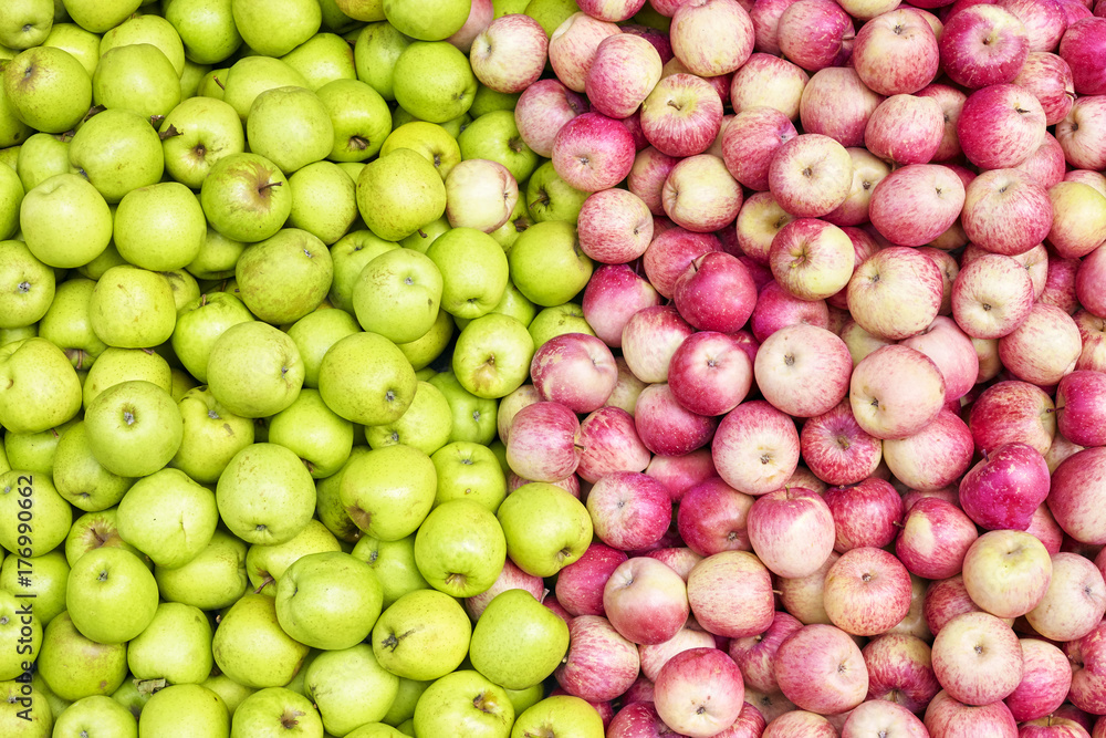 Red and green apples on a local market, fruit background. Red and green apples on a local market, fruit background.