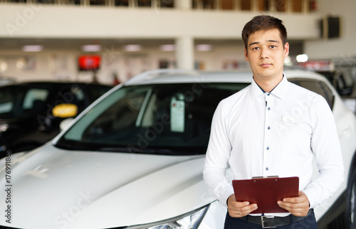 salesman about new car in dealership