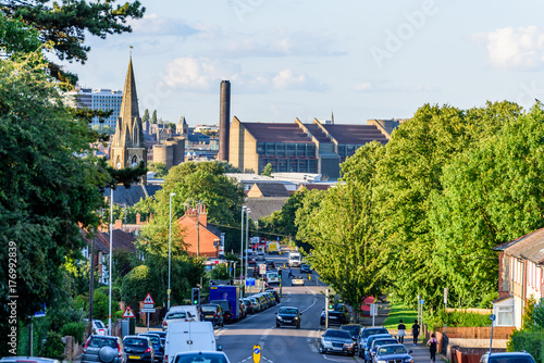 Cloudy Day Cityscape View of Northampton UK with road in foreground photo