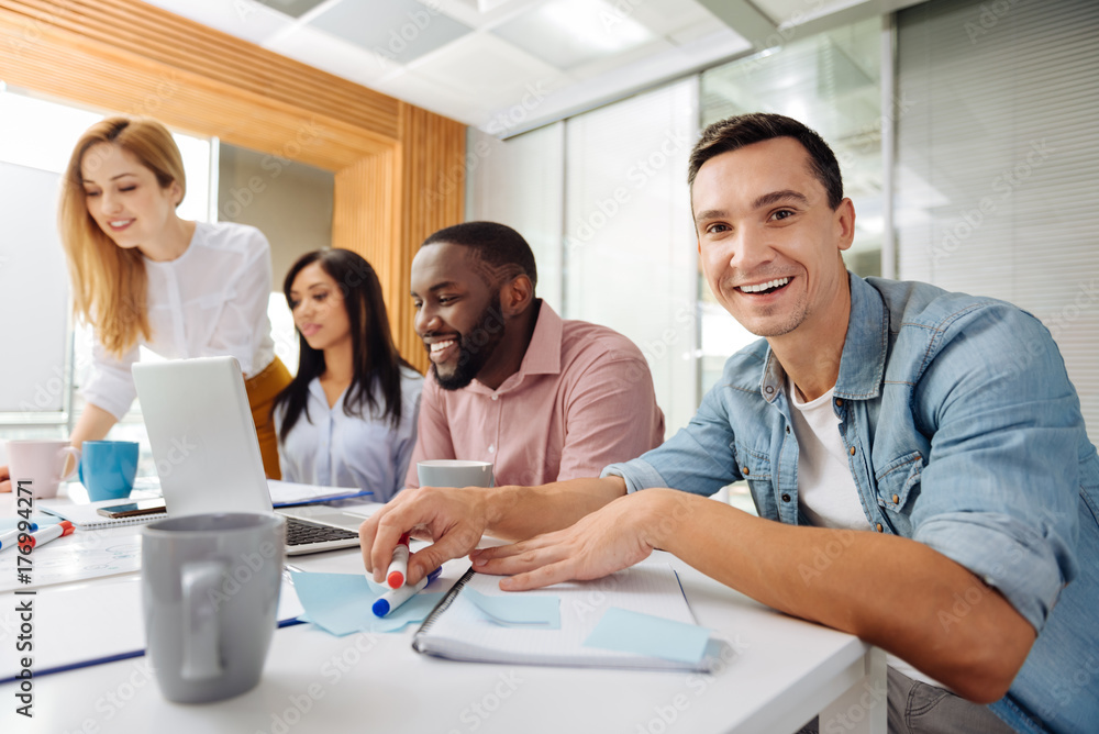 Obraz premium Smiling male person looking at camera