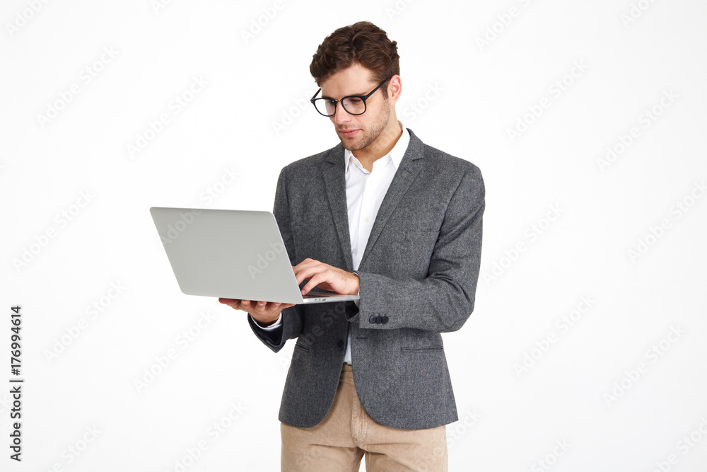 Portrait of a young concentrated businessman in eyeglasses Portrait of a young concentrated businessman in eyeglasses