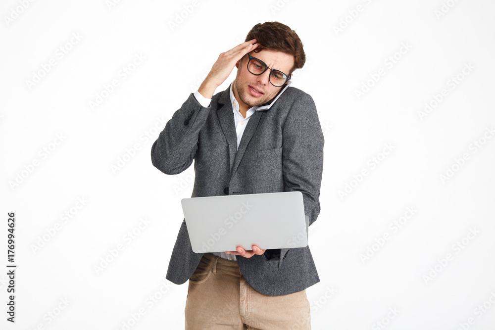 Portrait of a puzzled businessman in eyeglasses Portrait of a puzzled businessman in eyeglasses
