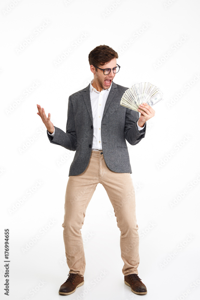 Full length portrait of cheerful excited man in eyeglasses Full length portrait of cheerful excited man in eyeglasses