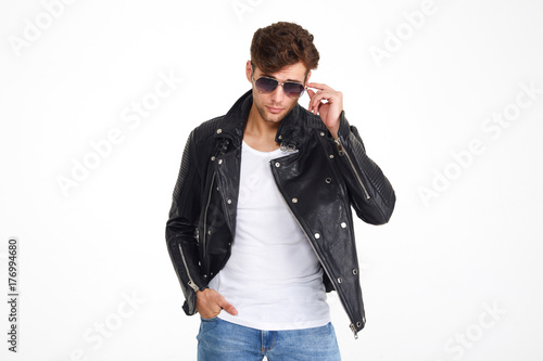 Portrait of a handsome brutal man in a leather jacket © Drobot Dean