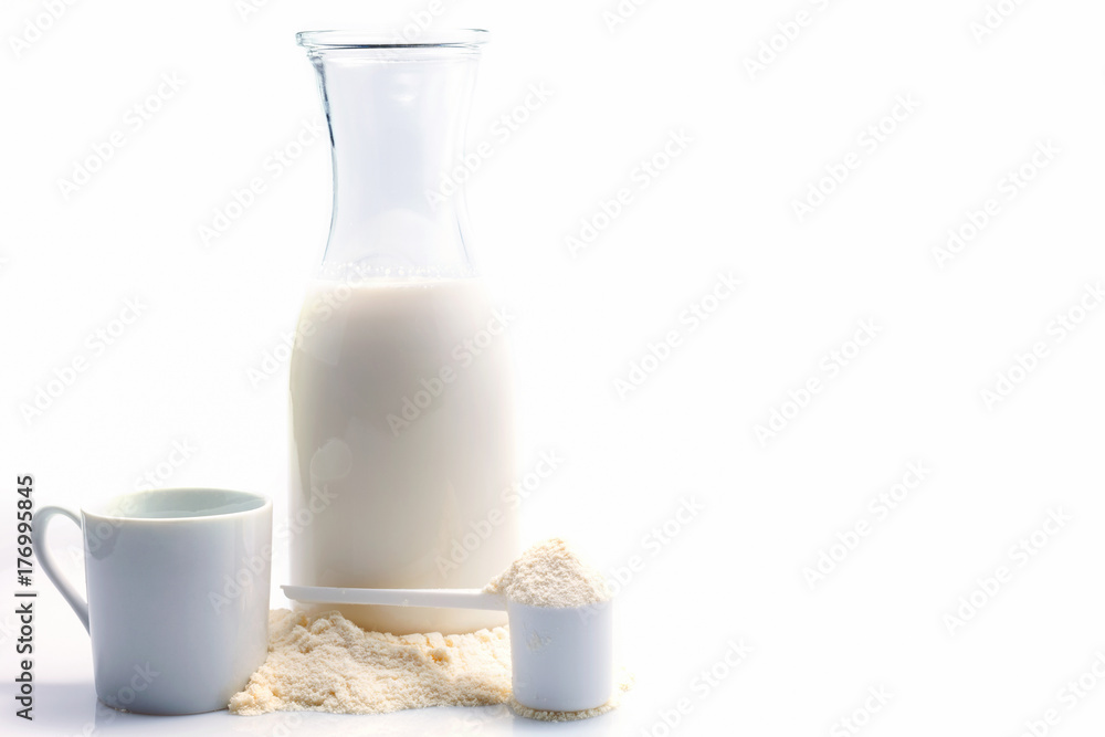 Bottle of fresh milk with powdered milk and spoon for baby on white background. Bottle of fresh milk with powdered milk and spoon for baby on white background.