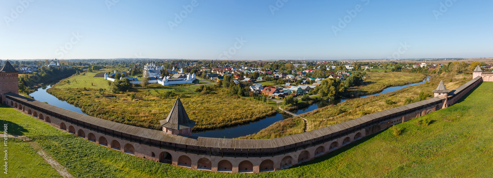 Panorama of Suzdal with the fortress wall of the Spaso-Evfimiev Monastery, the river Kamenka and a view of the Intercession Monastery. Panorama of Suzdal with the fortress wall of the Spaso-Evfimiev Monastery, the river Kamenka and a view of the Intercession Monastery.