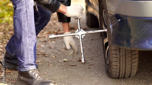 man changing wheel on a car