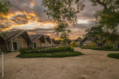 Small guest houses over a beautiful sunset. Philippines. The island of Palawan.
