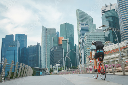 man take exercise by bicycle in singapore city photo