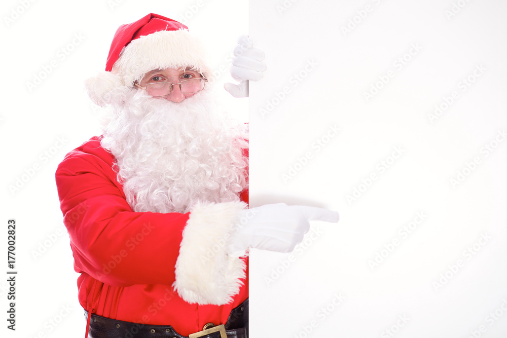 Kind Santa Claus pointing in white blank sign, isolated on white background Kind Santa Claus pointing in white blank sign, isolated on white background