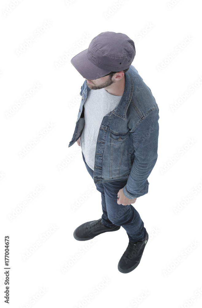 Naklejka premium view from above. guy in a baseball cap and denim jacket