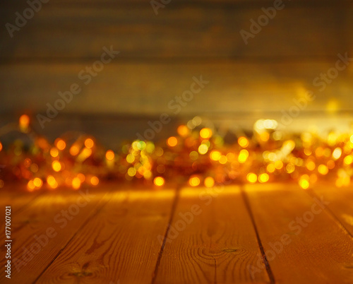 Wooden background with bright lights with a free space for text or product demonstration