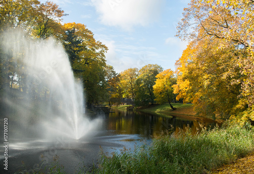 Golden autumn in a city park. Fountain in the Bastelkajna park in Riga, Latvia.
