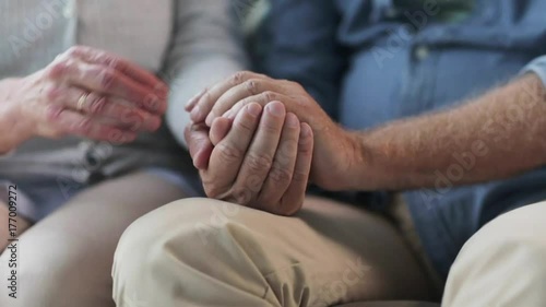 senior couple holding hands