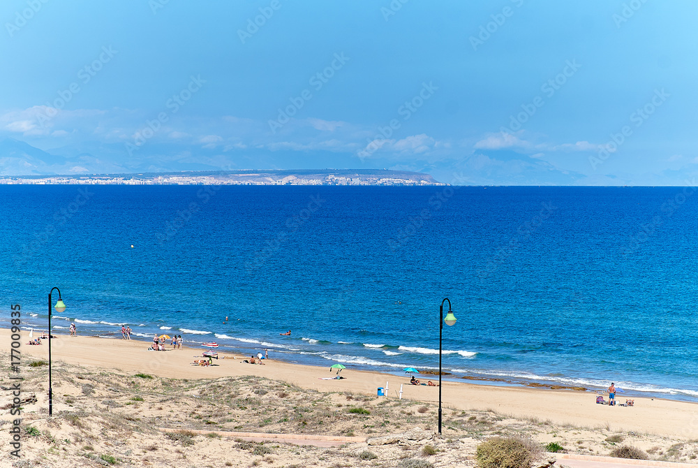 People on the beach of La Mata. Torrevieja, Spain