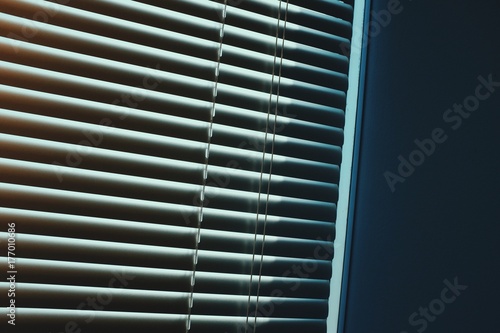 Office blinds creating abstract shapes, lines, light, shadows