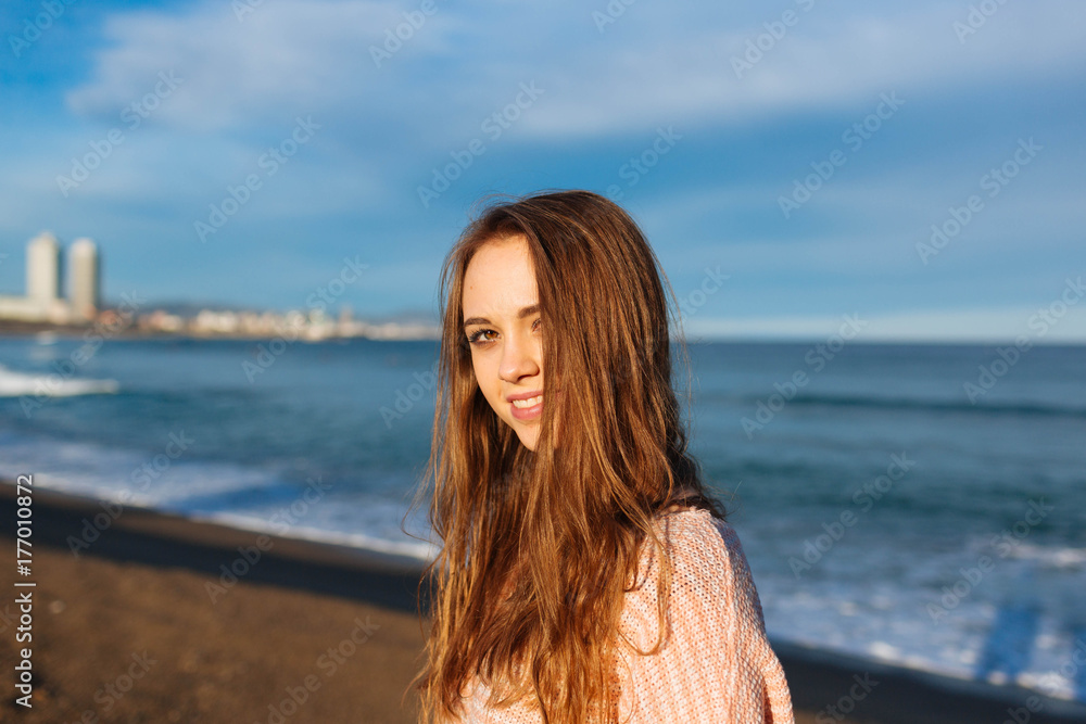 Portrait of a smiling young woman at sunset Portrait of a smiling young woman at sunset